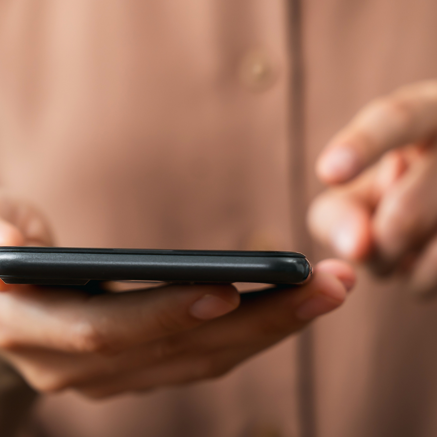Essential Terms of  Social Media Manger contract - close up image of woman typing on phone