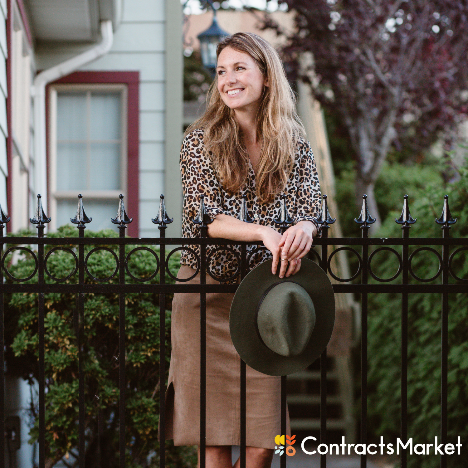 photo of Jaime Bell of Contracts Market holding hat 